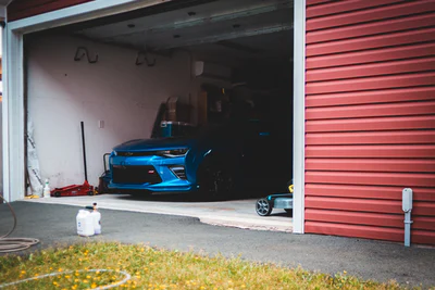 blue car in garage