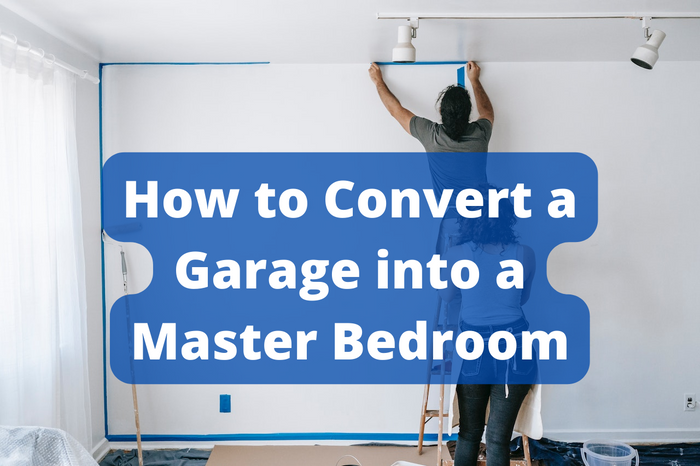 A couple painting a wall in their master bedroom