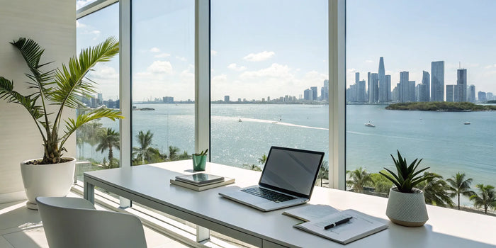 Preparing a Miami Dade permit application on a laptop with the Miami skyline in the background.