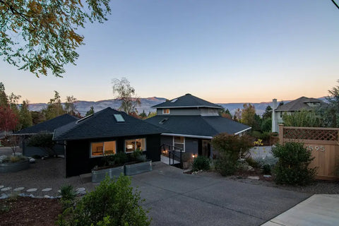 Asphalt driveway leading to house