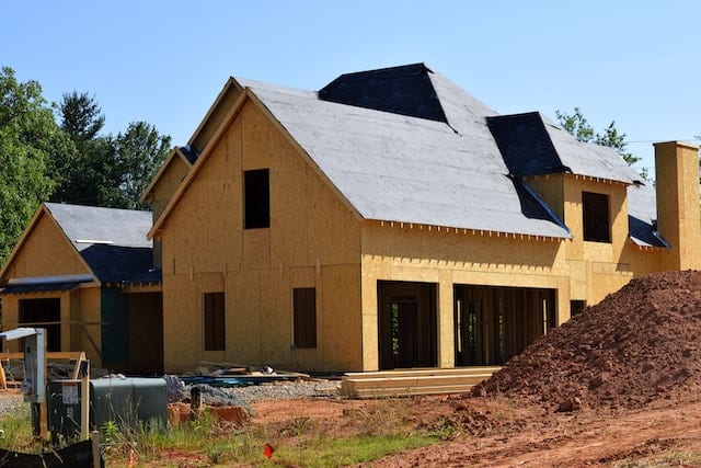 House covered in plywood under construction