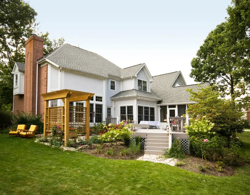 Image of two-story house and yard.