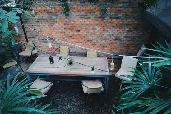 An example of a backyard landscape featuring an exposed brick wall