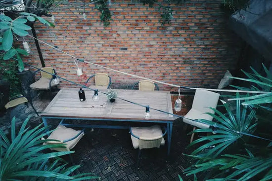 An example of a backyard landscape featuring an exposed brick wall