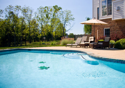 blue in-ground swimming pool with tiled edges and deck area shown for site plan in swimming pool structure drawing article