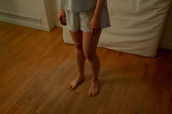 woman stepping on a squeeky floor