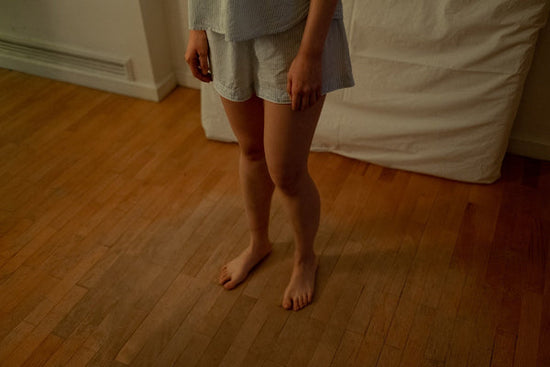 woman stepping on a squeeky floor 