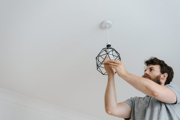 man fixing roof at home
