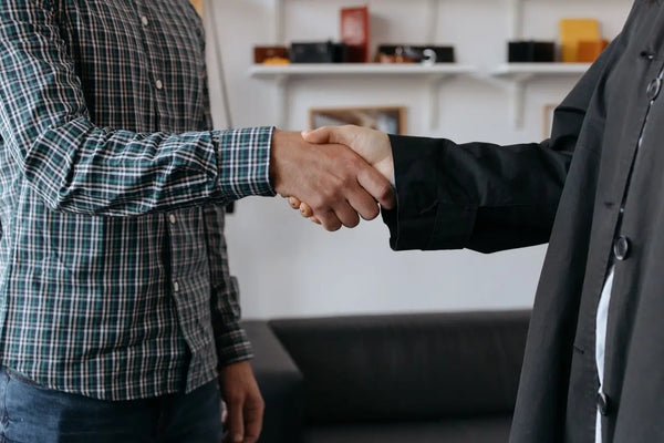 Close-up Photo of People doing Handshakes