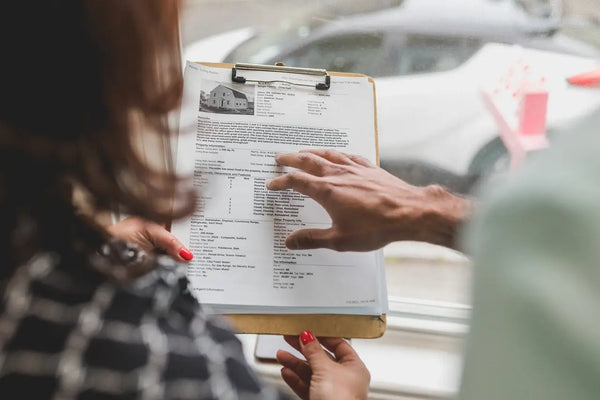 a homeowner holding a construction estimate