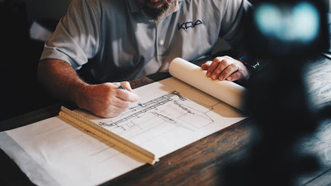 man drawing site plan